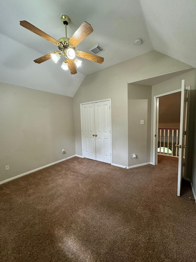 2232 Stableridge Dr, Conroe, TX 77384 - unfurnished bedroom with vaulted ceiling, baseboards, carpet, a closet, and ceiling fan