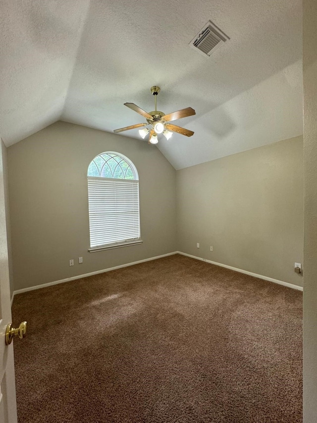 2232 Stableridge Dr, Conroe, TX 77384 - bonus room with lofted ceiling, a ceiling fan, carpet floors, a textured ceiling, and baseboards