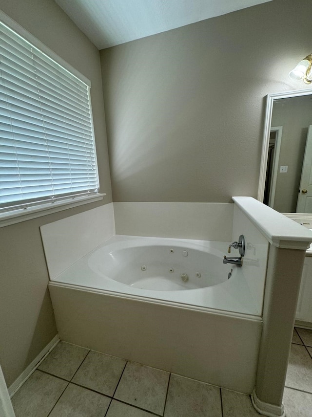 2232 Stableridge Dr, Conroe, TX 77384 - full bath featuring a whirlpool tub, tile patterned floors, and vanity