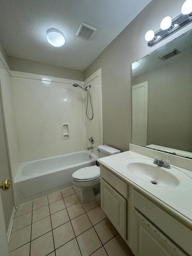 2232 Stableridge Dr, Conroe, TX 77384 - bathroom with shower / tub combination, tile patterned flooring, vanity, toilet, and a textured ceiling