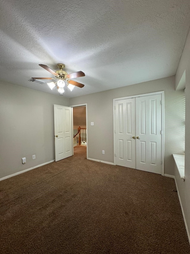 2232 Stableridge Dr, Conroe, TX 77384 - unfurnished bedroom with baseboards, carpet, a textured ceiling, ceiling fan, and a closet