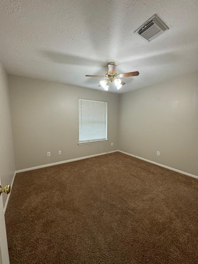 2232 Stableridge Dr, Conroe, TX 77384 - empty room with carpet flooring, a ceiling fan, baseboards, and a textured ceiling