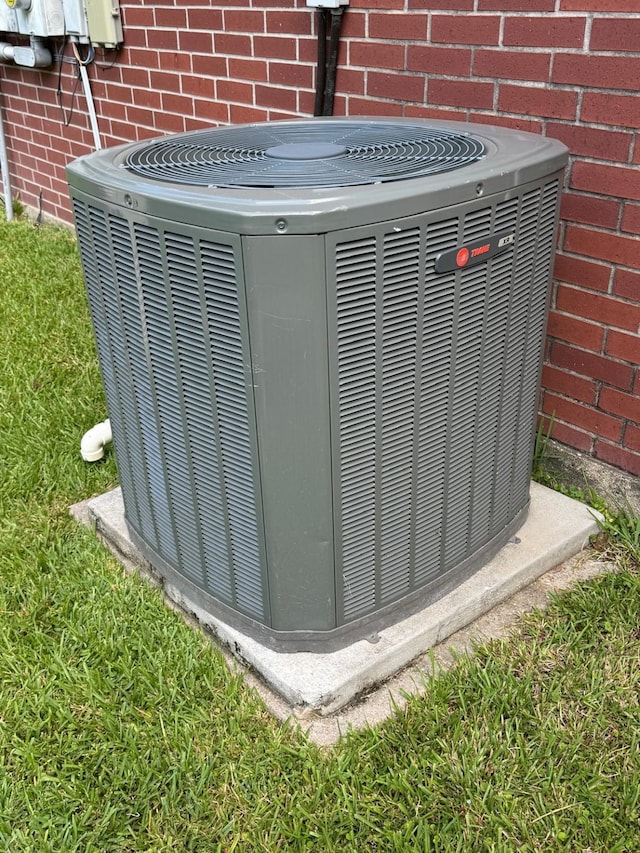 2232 Stableridge Dr, Conroe, TX 77384 - exterior view of central air condition unit and brick siding