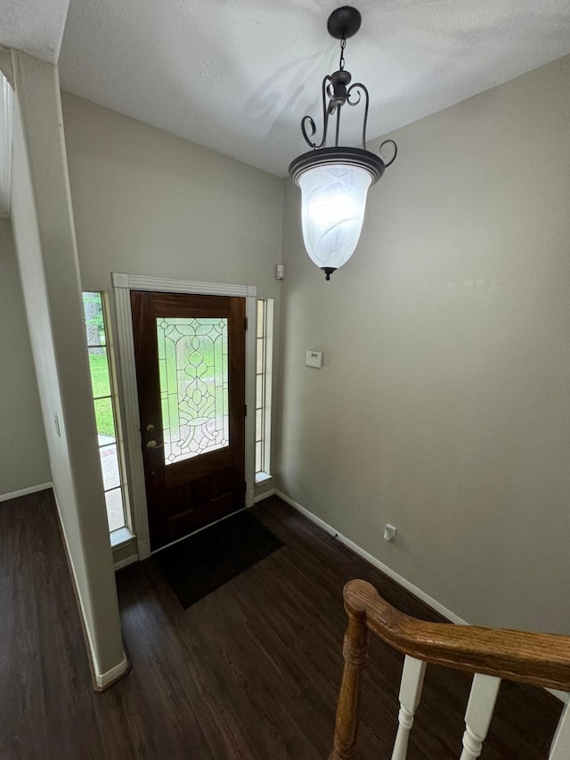 2232 Stableridge Dr, Conroe, TX 77384 - foyer featuring dark wood finished floors and baseboards