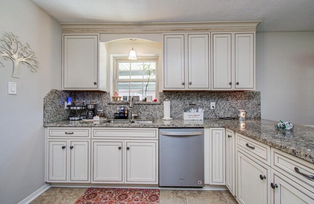 3305 Park Shadow Ln, Deer Park, TX 77536 - kitchen with stainless steel dishwasher, a sink, tasteful backsplash, and light stone counters