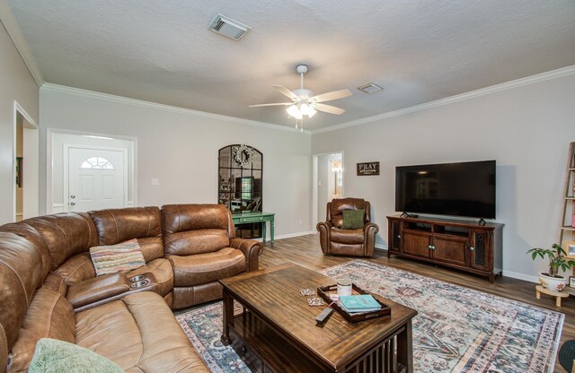 3305 Park Shadow Ln, Deer Park, TX 77536 - living room with wood finished floors, crown molding, a ceiling fan, and baseboards