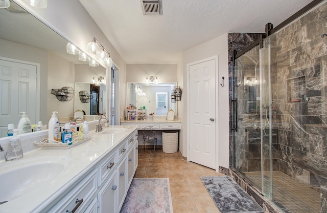 3305 Park Shadow Ln, Deer Park, TX 77536 - full bath featuring double vanity, a shower stall, and tile patterned flooring