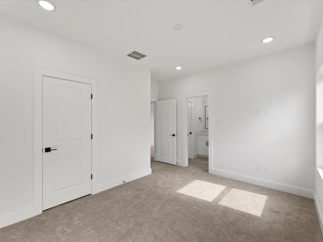7729 Ave J Unit A, Houston, TX 77012 - unfurnished bedroom with carpet flooring, recessed lighting, baseboards, and ensuite bath