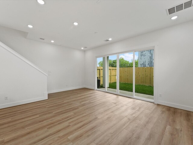 7729 Ave J Unit A, Houston, TX 77012 - spare room with recessed lighting, light wood-type flooring, and baseboards