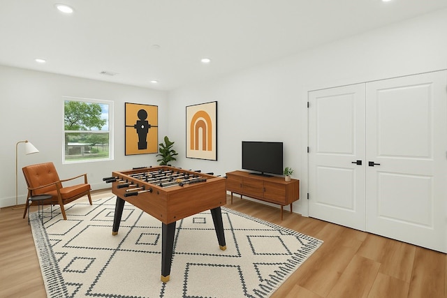 7729 Ave J Unit A, Houston, TX 77012 - game room with light wood-style flooring, recessed lighting, and baseboards