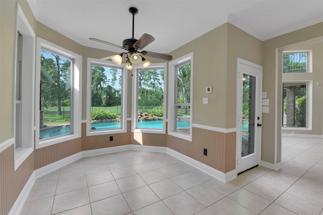14806 Cantwell Bnd, Cypress, TX 77429 - unfurnished sunroom featuring plenty of natural light, tile patterned flooring, wainscoting, wooden walls, and ornamental molding