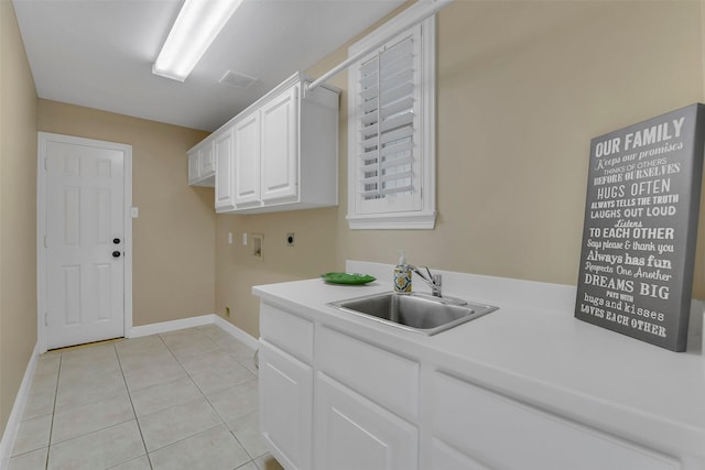 14806 Cantwell Bnd, Cypress, TX 77429 - laundry room featuring hookup for an electric dryer, cabinet space, washer hookup, and light tile patterned floors