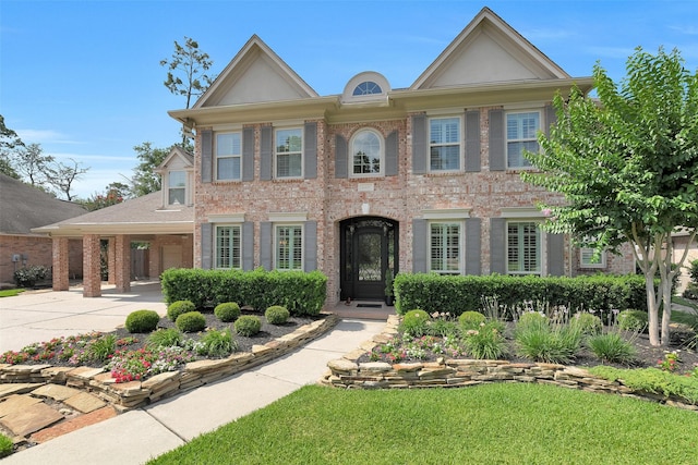 14806 Cantwell Bnd, Cypress, TX 77429 - colonial house featuring brick siding and a front yard