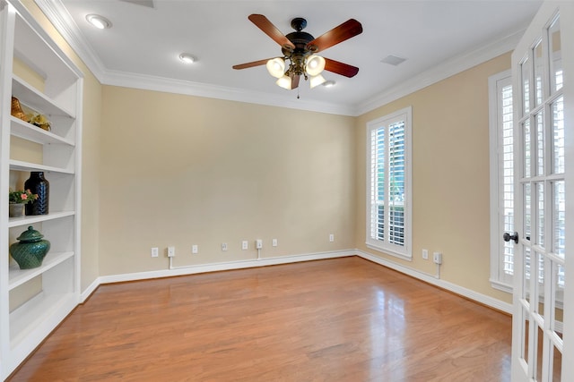 14806 Cantwell Bnd, Cypress, TX 77429 - unfurnished room with ceiling fan, wood finished floors, ornamental molding, and built in features