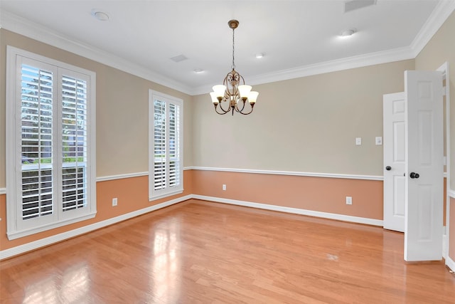 14806 Cantwell Bnd, Cypress, TX 77429 - empty room featuring plenty of natural light, light wood-style floors, a chandelier, and ornamental molding
