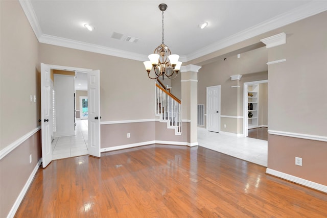 14806 Cantwell Bnd, Cypress, TX 77429 - unfurnished room with a chandelier, ornamental molding, wood finished floors, and stairway