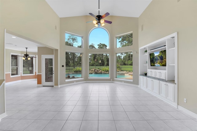 14806 Cantwell Bnd, Cypress, TX 77429 - unfurnished living room featuring a ceiling fan, high vaulted ceiling, and light tile patterned floors