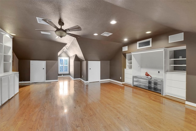 14806 Cantwell Bnd, Cypress, TX 77429 - bonus room featuring built in features, wood finished floors, ceiling fan, vaulted ceiling, and recessed lighting