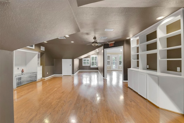 14806 Cantwell Bnd, Cypress, TX 77429 - unfurnished living room with a textured ceiling, light wood-style flooring, built in features, ceiling fan, and recessed lighting