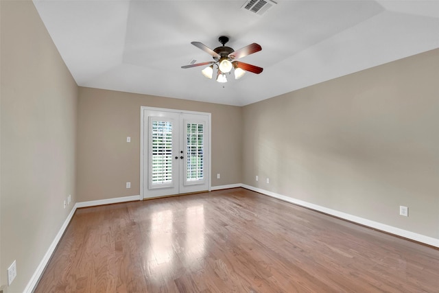 14806 Cantwell Bnd, Cypress, TX 77429 - empty room featuring a ceiling fan, wood finished floors, and french doors