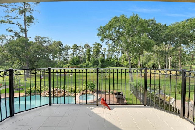 14806 Cantwell Bnd, Cypress, TX 77429 - balcony with view of wooded area, view of pool, and a pool with connected hot tub