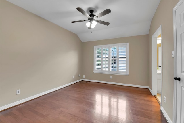 14806 Cantwell Bnd, Cypress, TX 77429 - empty room with wood finished floors, vaulted ceiling, and ceiling fan
