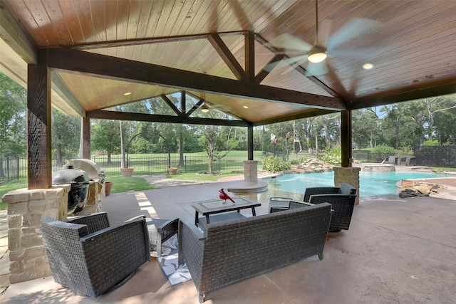 14806 Cantwell Bnd, Cypress, TX 77429 - fenced backyard with a patio, an in-ground hot tub, view of wooded area, ceiling fan, and a grill