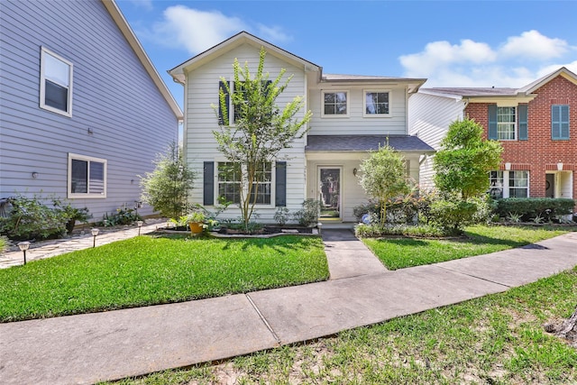 26881 Manor Crest Ct, Kingwood, TX 77339 - view of front of property with a front lawn