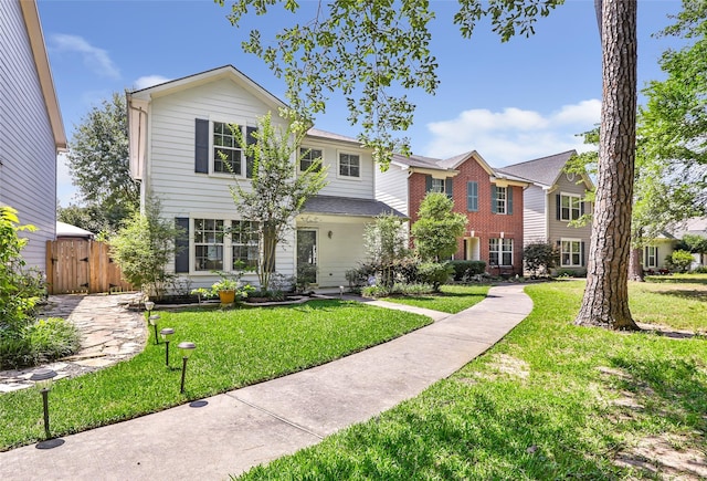 26881 Manor Crest Ct, Kingwood, TX 77339 - view of front facade with a front lawn and a gate