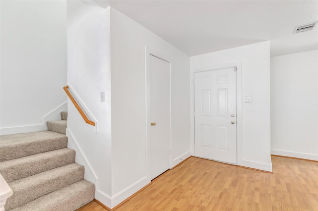 26881 Manor Crest Ct, Kingwood, TX 77339 - staircase with wood finished floors and baseboards
