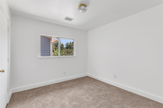 26881 Manor Crest Ct, Kingwood, TX 77339 - carpeted spare room featuring baseboards