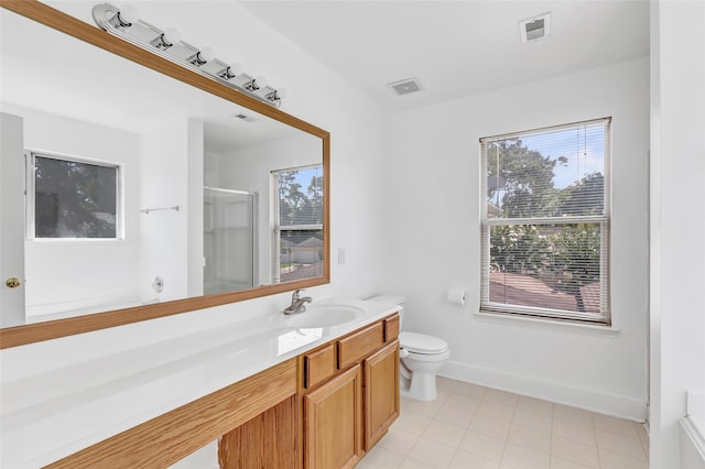 26881 Manor Crest Ct, Kingwood, TX 77339 - bathroom with plenty of natural light, vanity, an enclosed shower, and toilet