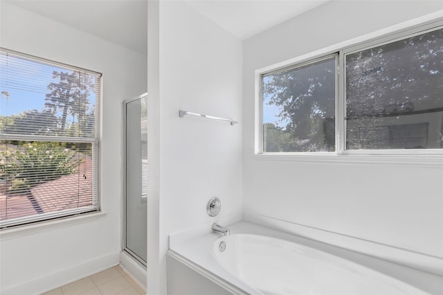 26881 Manor Crest Ct, Kingwood, TX 77339 - full bath with a garden tub, tile patterned floors, and an enclosed shower