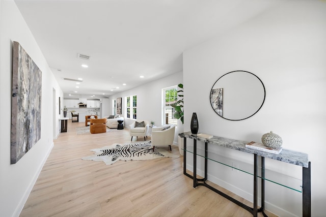 1310 E 34th St, Houston, TX 77022 - corridor with light wood-style flooring, recessed lighting, and baseboards