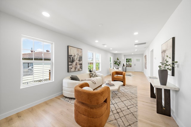 1310 E 34th St, Houston, TX 77022 - living area featuring light wood-style floors, recessed lighting, and baseboards