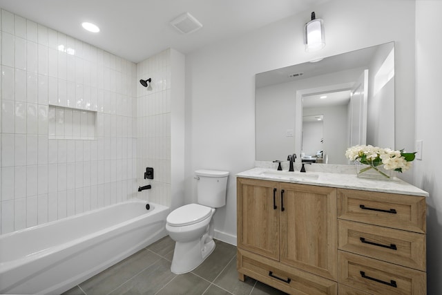 1310 E 34th St, Houston, TX 77022 - full bathroom featuring vanity, toilet, tub / shower combination, and tile patterned flooring