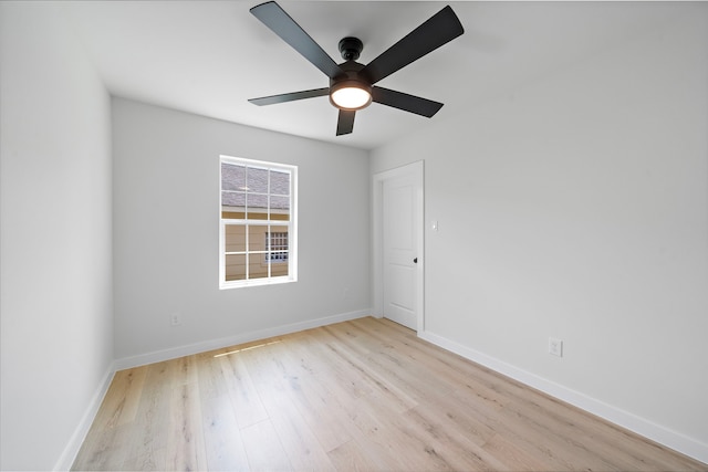 1310 E 34th St, Houston, TX 77022 - unfurnished room featuring wood finished floors, a ceiling fan, and baseboards
