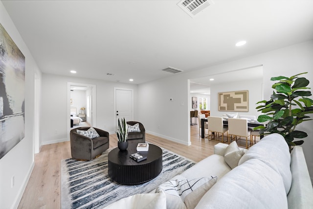 1310 E 34th St, Houston, TX 77022 - living room with light wood-style flooring, recessed lighting, and baseboards