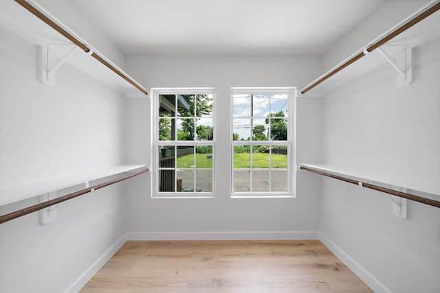 1310 E 34th St, Houston, TX 77022 - walk in closet featuring light wood finished floors