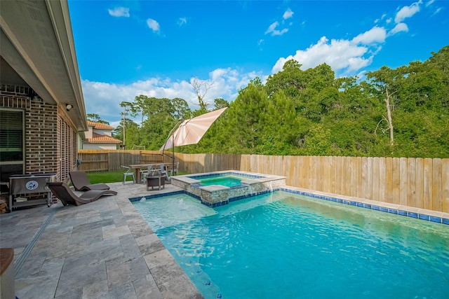 13707 Rivendell Crest Ln, Cypress, TX 77429 - view of pool with a patio area, a fenced backyard, and a pool with connected hot tub