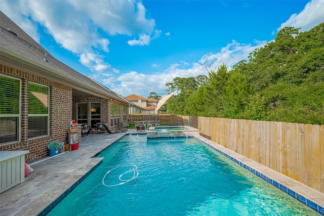 13707 Rivendell Crest Ln, Cypress, TX 77429 - view of swimming pool featuring a patio, a fenced backyard, and a pool with connected hot tub