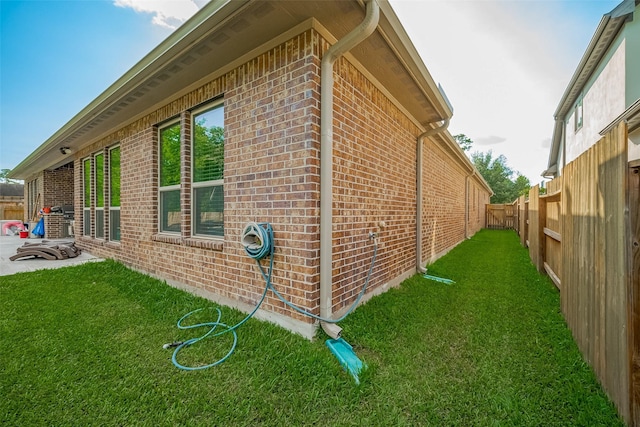 13707 Rivendell Crest Ln, Cypress, TX 77429 - view of home's exterior featuring brick siding and a fenced backyard