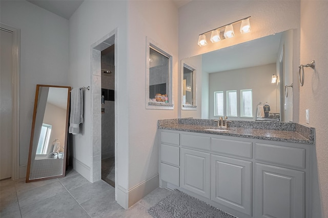 13707 Rivendell Crest Ln, Cypress, TX 77429 - bathroom featuring a tile shower, vanity, and tile patterned floors