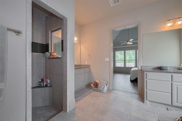 13707 Rivendell Crest Ln, Cypress, TX 77429 - ensuite bathroom featuring vanity, a walk in shower, tile patterned flooring, and a ceiling fan