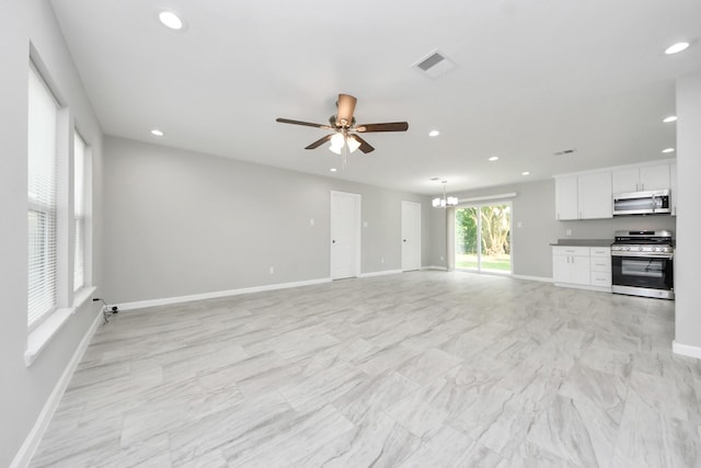 5911 Southurst St, Houston, TX 77033 - unfurnished living room with recessed lighting, ceiling fan, a chandelier, and baseboards