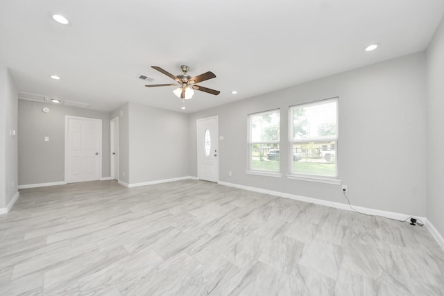 5911 Southurst St, Houston, TX 77033 - unfurnished living room with attic access, ceiling fan, recessed lighting, and baseboards