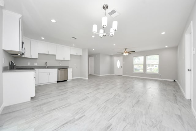 5911 Southurst St, Houston, TX 77033 - kitchen with stainless steel dishwasher, ceiling fan, a chandelier, recessed lighting, and white cabinets