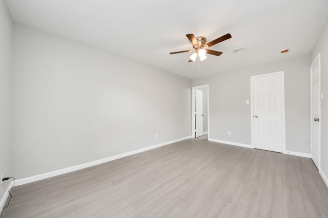 5911 Southurst St, Houston, TX 77033 - unfurnished bedroom featuring wood finished floors, baseboards, and a ceiling fan
