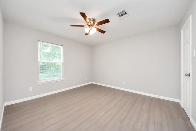 5911 Southurst St, Houston, TX 77033 - unfurnished room featuring ceiling fan, wood finished floors, and baseboards