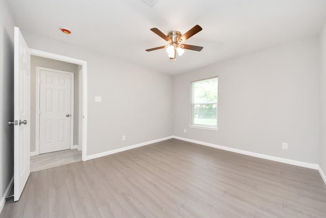 5911 Southurst St, Houston, TX 77033 - spare room with ceiling fan, baseboards, and wood finished floors